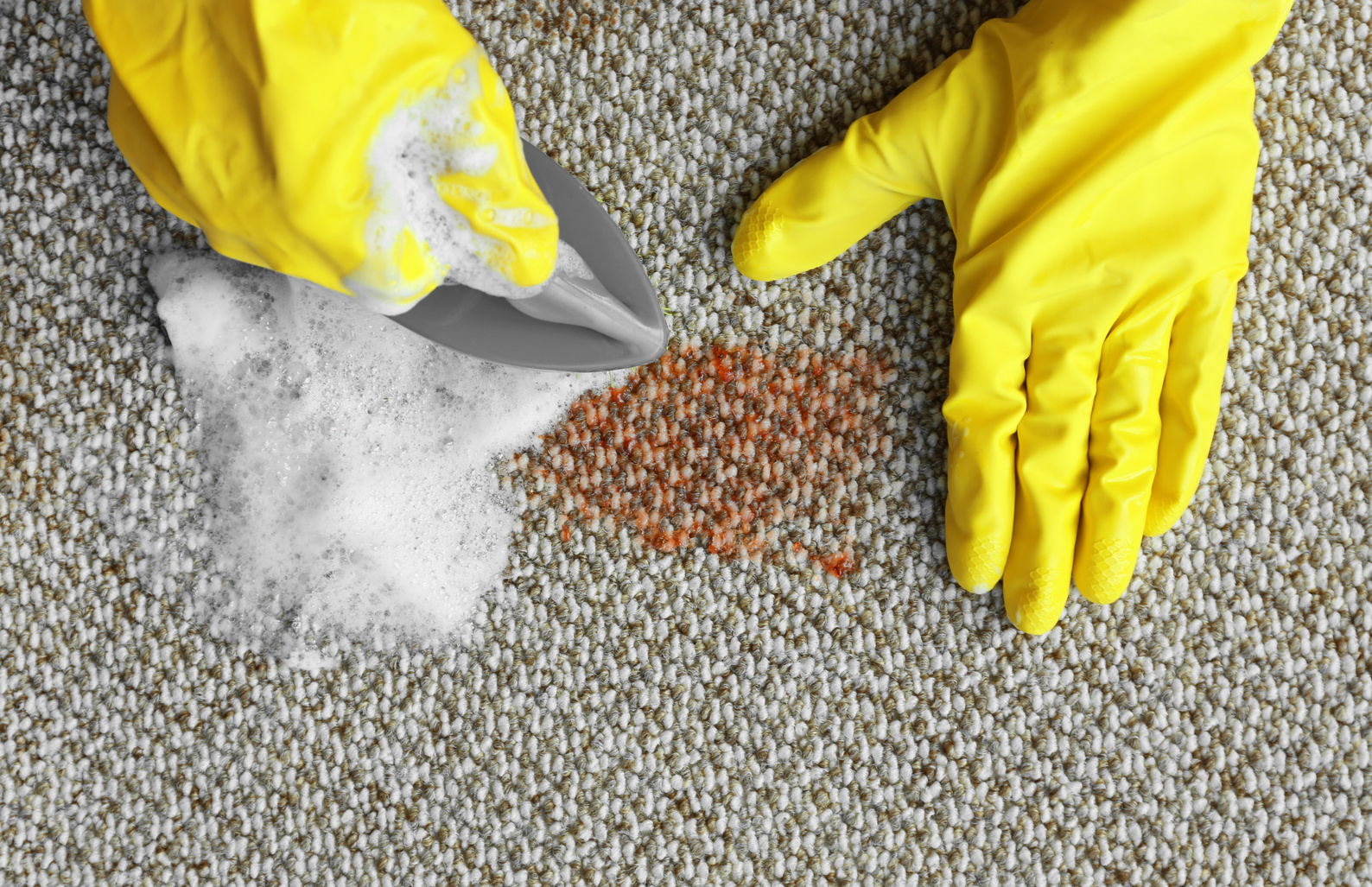 Man Wearing Yellow Gloves Cleaning Carpet